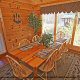 Dining room with a view in cabin 859 (Absolute Paradise) , in Pigeon Forge, Tennessee.