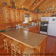 Fully furnished country kitchen in cabin 859 (Absolute Paradise) , in Pigeon Forge, Tennessee.