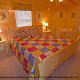 Bedroom with King Size Bed in Cabin 860 (Cozy Bear Overlook) at Eagles Ridge Resort at Pigeon Forge, Tennessee.