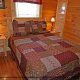 Country bedroom in cabin 864 (The Cedars) at Eagles Ridge Resort at Pigeon Forge, Tennessee.
