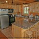 Fully furnished country kitchen in cabin 864 (The Cedars) at Eagles Ridge Resort at Pigeon Forge, Tennessee.