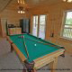 Game room with pool table in cabin 864 (The Cedars) at Eagles Ridge Resort at Pigeon Forge, Tennessee.