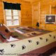 One of the many fully furnished luscious bedrooms in cabin 88 (Mountain Magic), in Pigeon Forge, Tennessee.