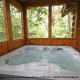 Slip into the warm of this soothing hot tub in cabin 90 (Treasured Moments), in Pigeon Forge, Tennessee.