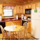 Dining room with kitchen in cabin 91 (Eagles Beauty) , in Pigeon Forge, Tennessee.