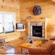 Living room with fireplace in cabin 91 (Eagles Beauty) , in Pigeon Forge, Tennessee.
