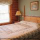 Bedroom View with King Size Bed in Cabin 92 (Virginias Villa) at Eagles Ridge Resort at Pigeon Forge, Tennessee.