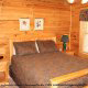 Bedroom View with Queen Size Bed in Cabin 99 (Bear Tracks) at Eagles Ridge Resort at Pigeon Forge, Tennessee.
