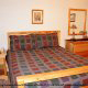 Bedroom View with Full Size Bed in Cabin 99 (Bear Tracks) at Eagles Ridge Resort at Pigeon Forge, Tennessee.