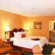 Luxury King Size Bed Room View at the Hampton Inn Hotel in Gulfport, near Biloxi, Mississippi. Read a book and relax during your Memorial Day Vacation getaway. 