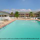 Outdoor Pool View at the Super 8 Motel in Biloxi, Mississippi. Relax by the Pool during your President's Day Getaway to Biloxi.