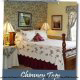 Spectacular queen size bed in this country cottage room at Pigeon Forge Lodging premier ::Blue Mountain Mist