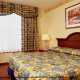 King Size Room View at Country Inn & Suites By Carlson Orlando-Maingate at Calypso in Orlando, Florida. Relax and have fun during your Valentines Day Romantic Getaway.