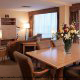 Spacious living room and dining room at the Crowne Plaza Hotel Orlando - Universal in Orlando, Florida.