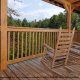 Back Porch With Rocking Chair in Mountain Lake Retreat Cabin at Gatlinburg, Tennessee.