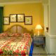 Bedroom furnished with tropical decor for a perfect vacation to the Grand Beach Resort Condos in Orlando Florida