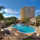 Outdoor Pool View at Hilton Garden Inn in Orlando, Florida. Feel welcomed and confident that you picked up the best hotel for your Christmas Family Vacation.