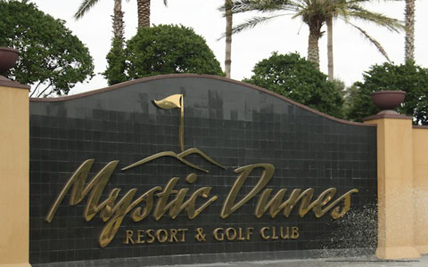 Resort Welcome Sign View at Mystic Dunes Resort & Golf Club in Orlando, Florida.