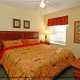 Bedroom with King Size Bed at Oak Plantation Resort in Orlando, Florida. Affordable vacation packages now available at Rooms101.com. 