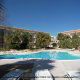 Outdoor Pool View with Chaise Lounge Chairs at the Ocean View Vacation Villas in Biloxi, Mississippi.