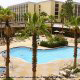 Enjoy a Refreshing Drink by the Pool at the Radisson Worldgate Resort in Orlando, Florida.