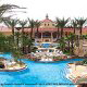Swimming Pavilion View with Water Slide and Lazy River at Regal Palms Resort & Spa in Orlando, Florida (just moments away from all the major attractions). Cheap Vacation Packages now available at Rooms101.com.