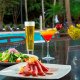 Enjoy light fare and tropical drinks poolside at Evergreen Poolside.