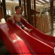 Toddler enjoys a water slide at the Wilderness Stone Hill Lodge in Pigeon Forge Tennessee.